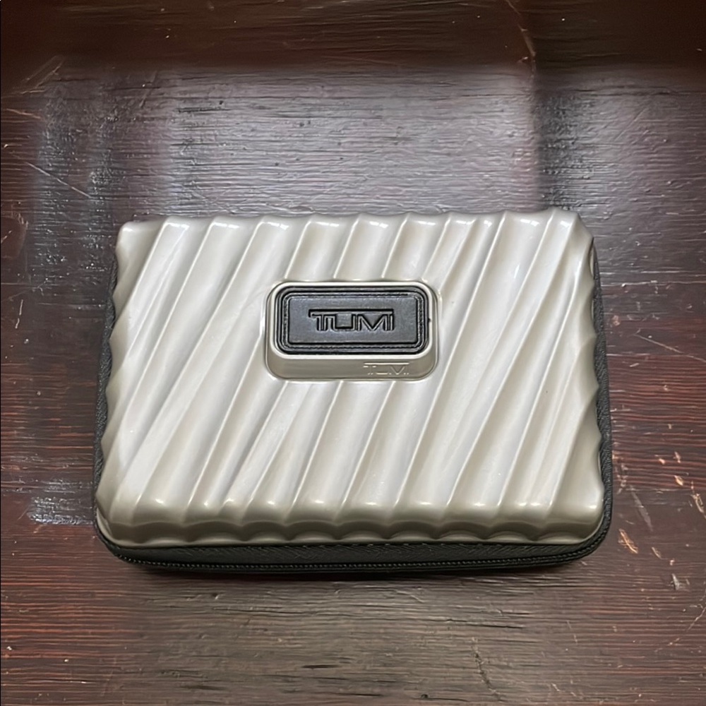 TUMI Silver Travel Size Hard Shell Case With Sturdy Black Zipper & Inner Elastic